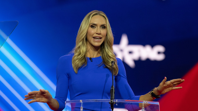 Lara Trump wearing a blue dress and speaking at 2023 CPAC