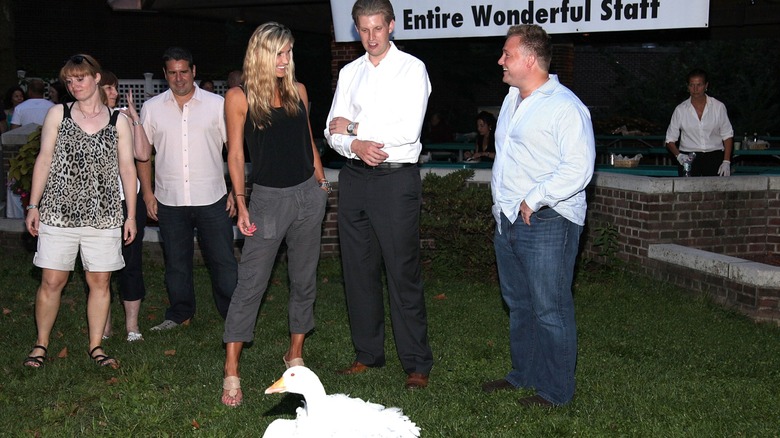 Lara Trump and Eric Trump posing with others at the Staten Island Zoo in 2012