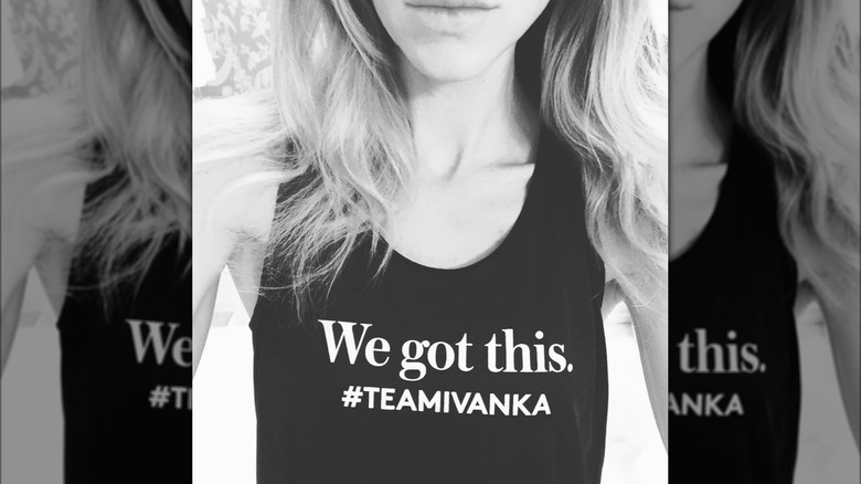 Shot of Lara Trump chin-down wearing black tank top reading "We got this. #teamivanka"