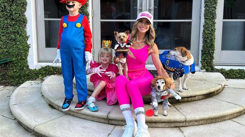 Lara Trump dressed as MAGA Barbie with kids and dogs in costume