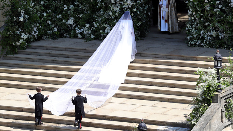 Meghan Markle walking toward church in wedding gown