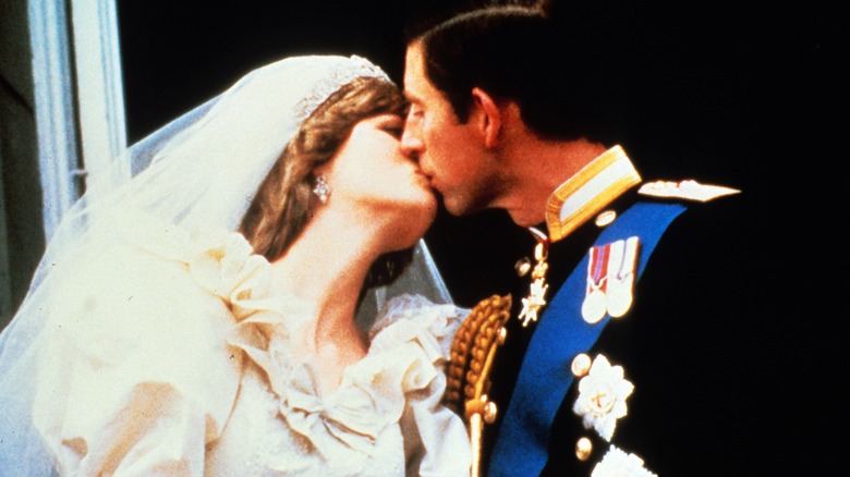 Princess Diana and Prince Charles kissing on wedding day
