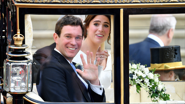 Princess Eugenie and Jack Brooksbank waving from their carriage