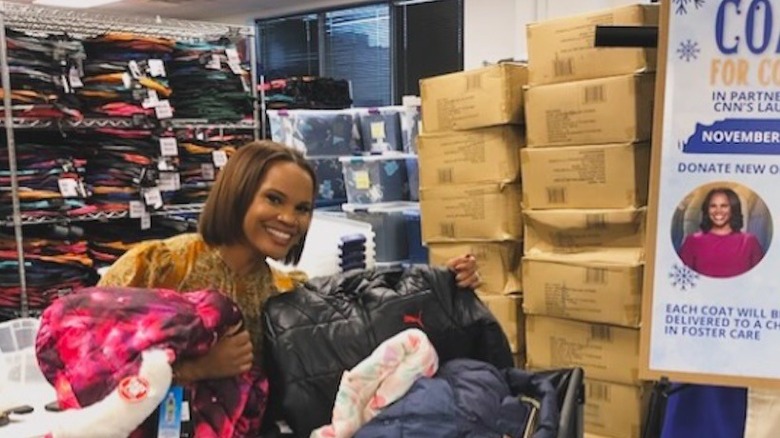 Laura Coates with coats collected from her charity coat drive