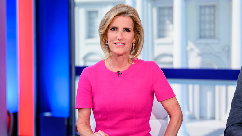 Laura Ingraham sitting at her desk