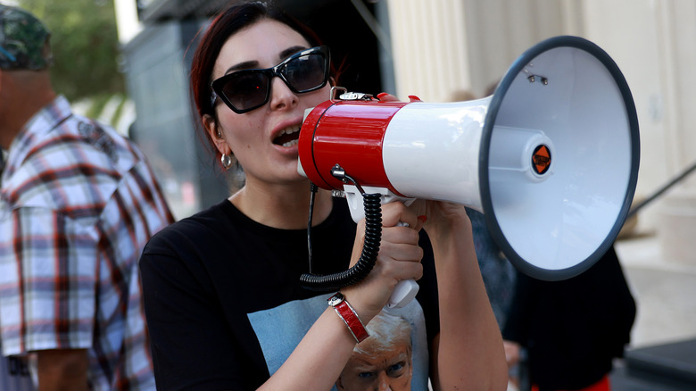 Laura Loomer speaking into a megaphone