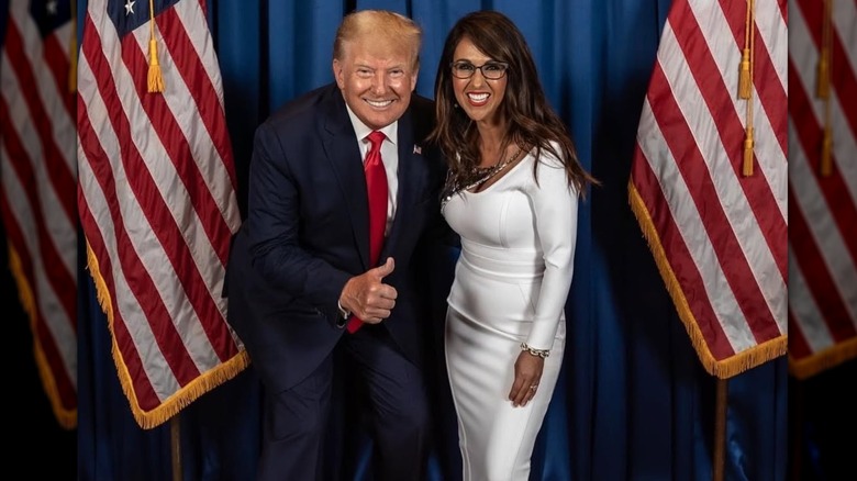 Donald Trump doing a thumbs up with Lauren Boebert tight white dress