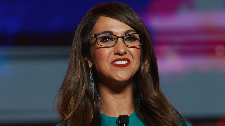 Lauren Boebert smiling turquoise earrings and dress