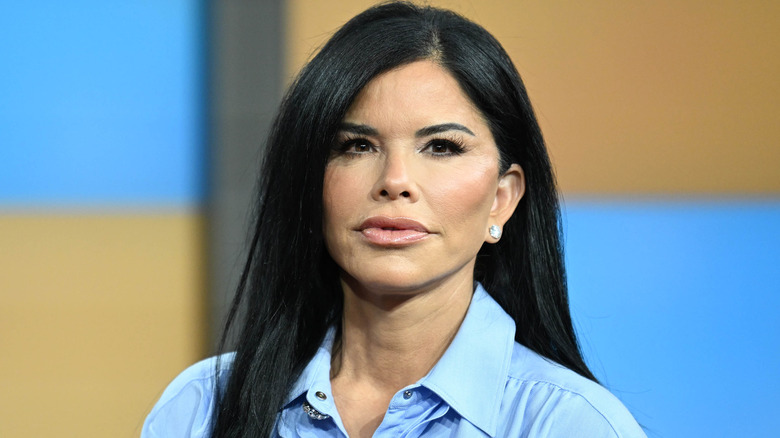 Lauren Sanchez on set with full makeup, full lips, tight jaw