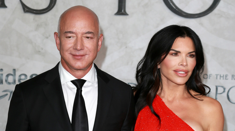 Jeff Bezos and Lauren Sanchez pose in formal clothing