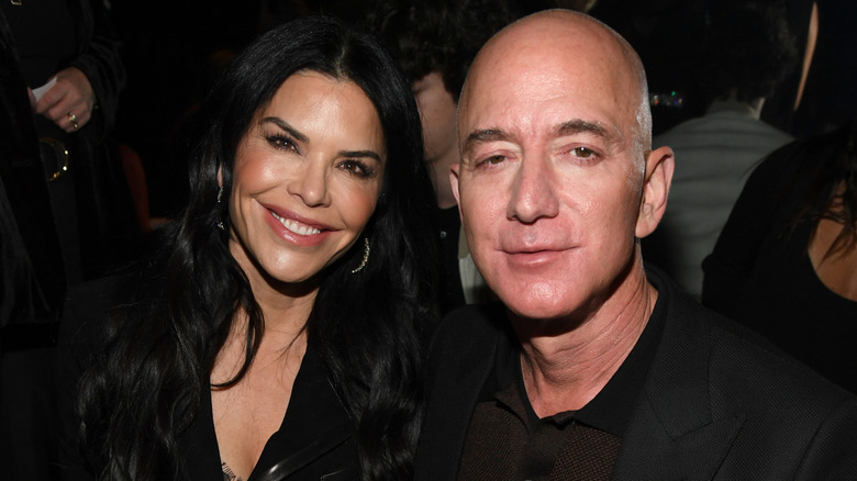 Lauren Sánchez and Jeff Bezos posing at an event