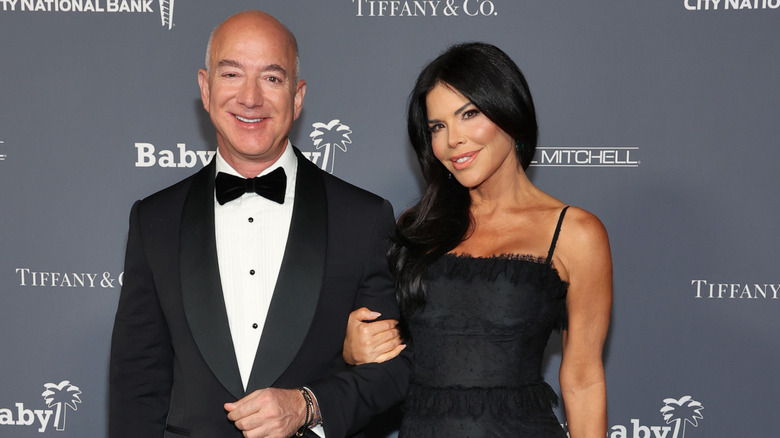 Jeff Bezos and Lauren Sánchez smiling at an event