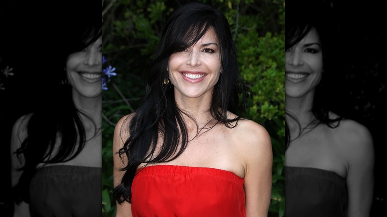 Lauren Sánchez smiling wearing red dress