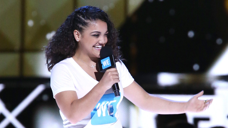 Laurie Hernandez speaks into microphone