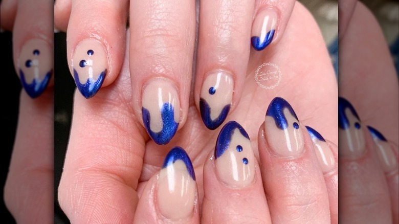 Blue french tip nails with drip effect