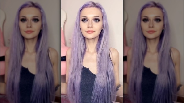 A woman with long lavender hair