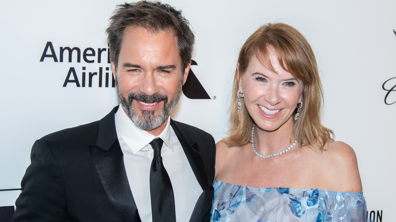 Janet Holden smiles alongside Eric McCormack