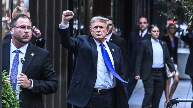 Donald Trump raises fist outside courthouse