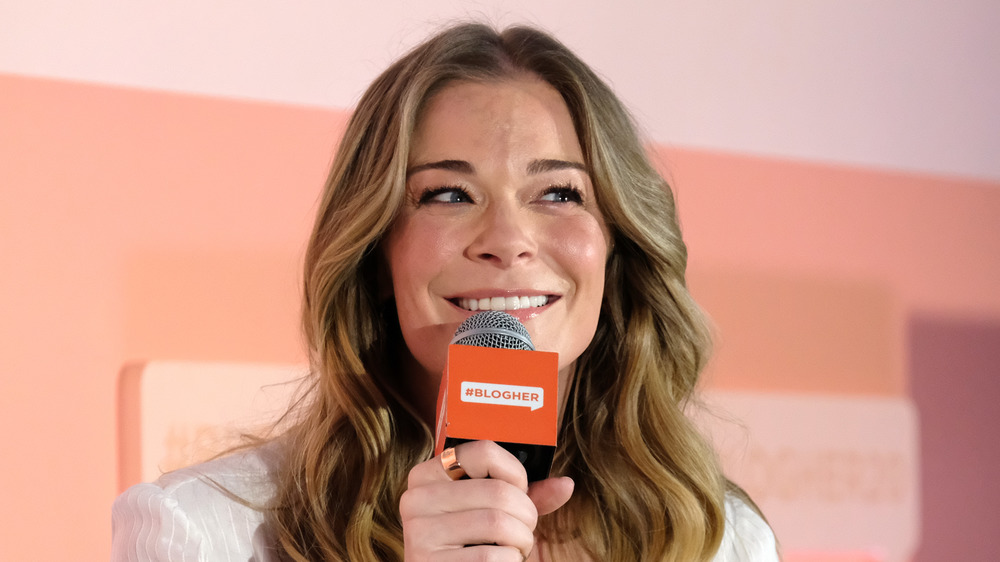 LeAnn Rimes speaking at an event.