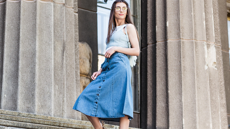 woman wearing denim skirt outside