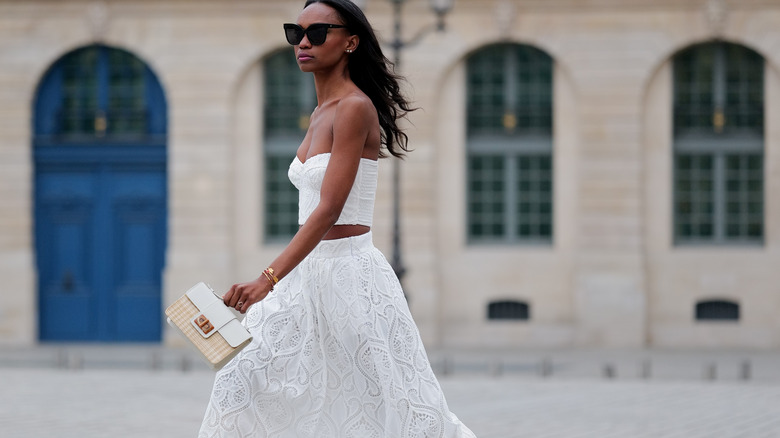 woman walking outside in skirt