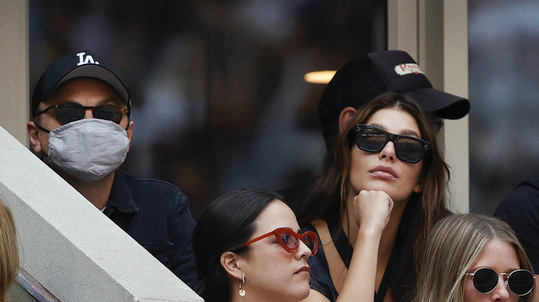 Leonardo DiCaprio and Camila Morrone watching a game 