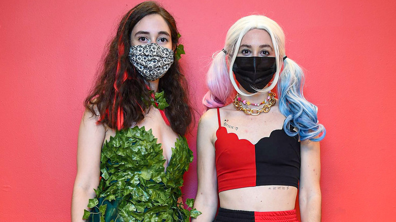 Women dressed as Poison Ivy and Harley Quinn