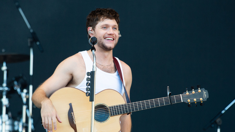 Niall Horan holding a guitar