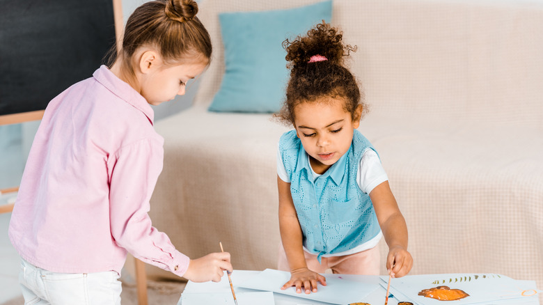 Two kids drawing