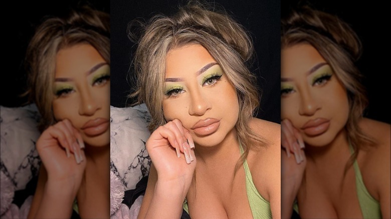 girl with green frosted eyeshadow