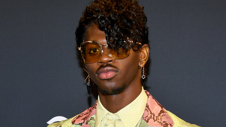 Lil Nas X wears green suit while accepting award