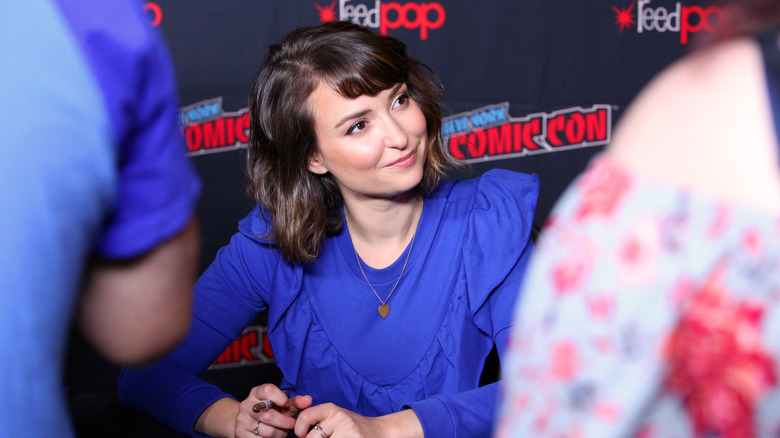 Milana Vayntrub at Comic-Con table