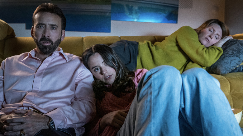 Nicolas Cage, Lily Sheen, and Sharon Horgan watching TV