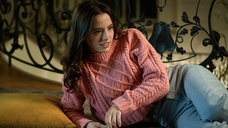 Lily Sheen wearing a pink sweater