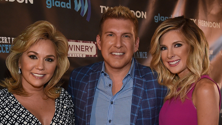 Lindsie Chrisley poses with parents Todd and Julie Chrisley