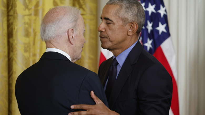 Joe Biden and Barack Obama looking at each other