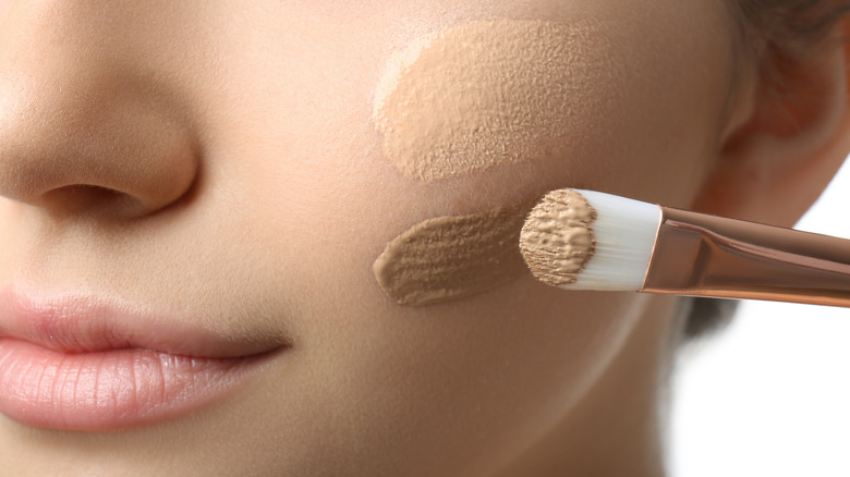 Woman swatch-testing foundation