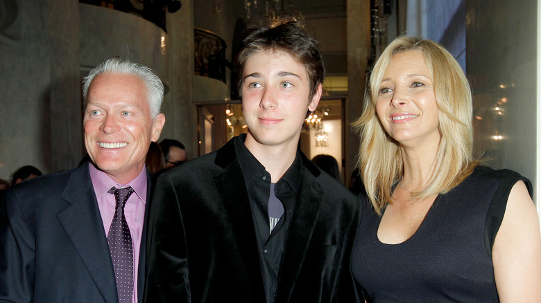 Julian Stern with parents, smiling