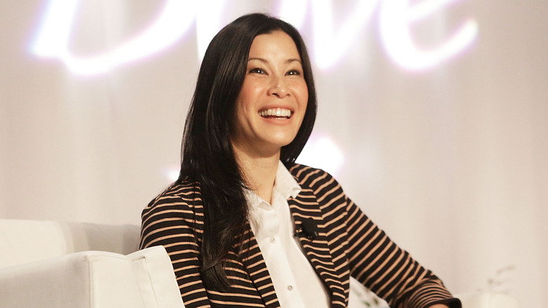 Lisa Ling smiling onstage at an event