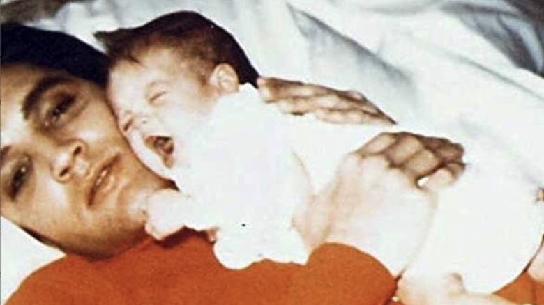 Baby Lisa Marie Presley with her father Elvis Presley