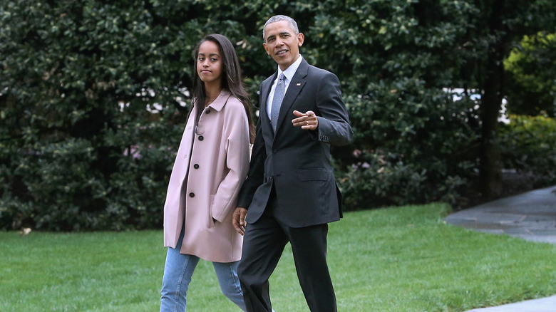 Malia Obama walking with her father Barack Obama