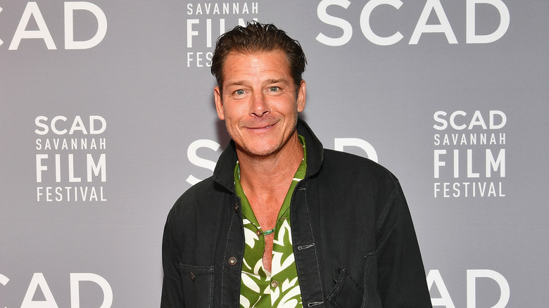 Ty Pennington posing on a red carpet