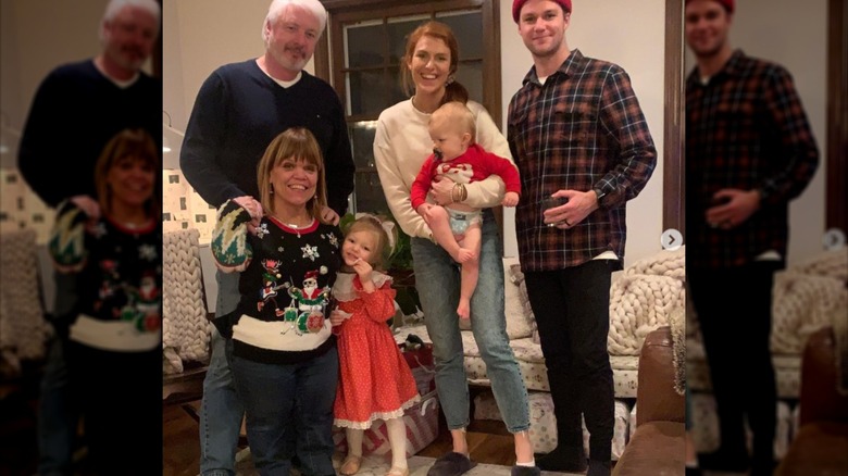 Amy Jeremy and Tori Roloff smiling with other family members