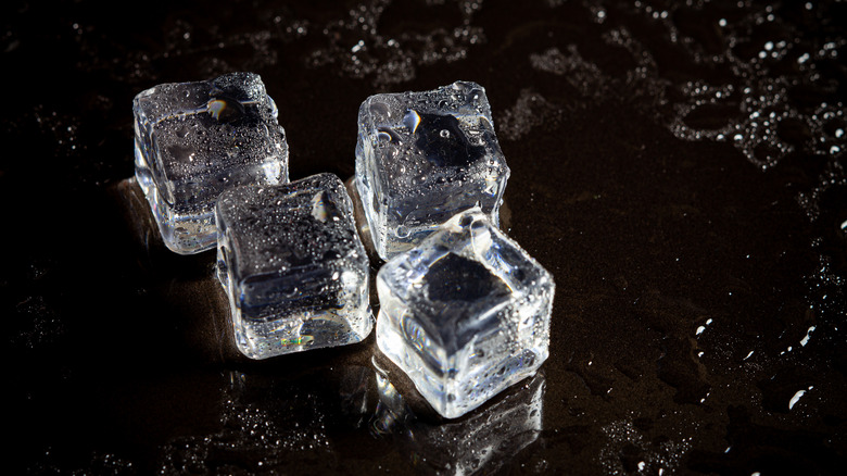 ice cubes on black surface