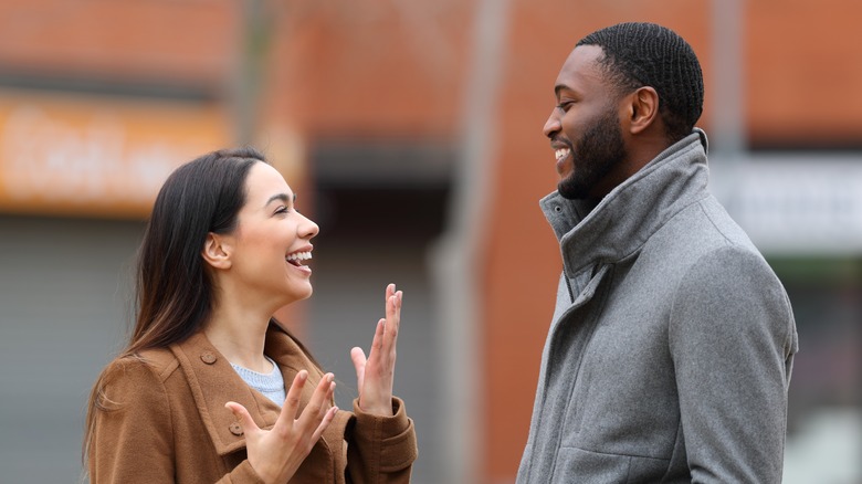 happy couple talking outside