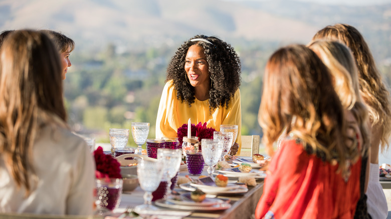 Lizzy Mathis at outdoor dinner party