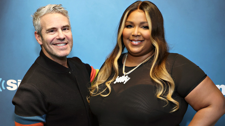 Lizzo and Andy Cohen smiling 