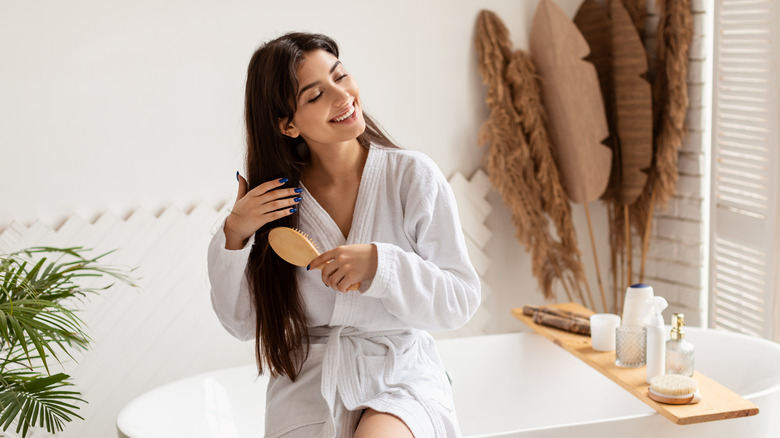 woman brushing her hair