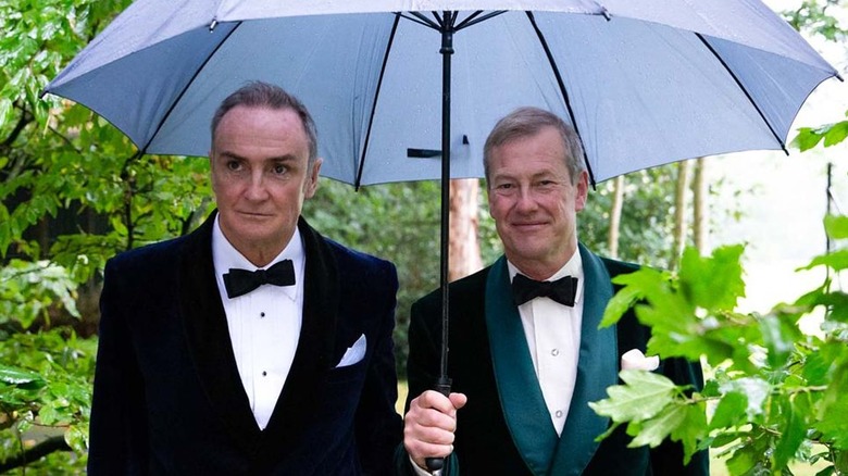 James Coyle and Lord Ivar walking under umbrella