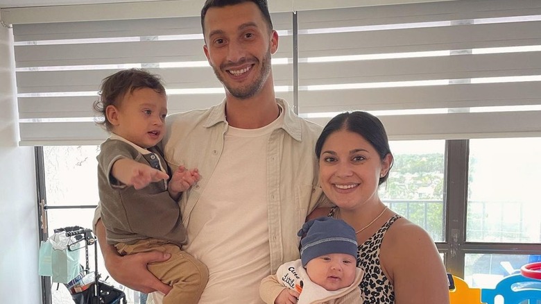 Loren and Alexei Brovarnik smiling with their children